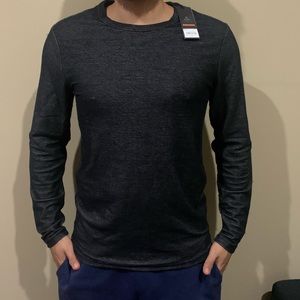 Black long sleeve shirt, models height is 5’8